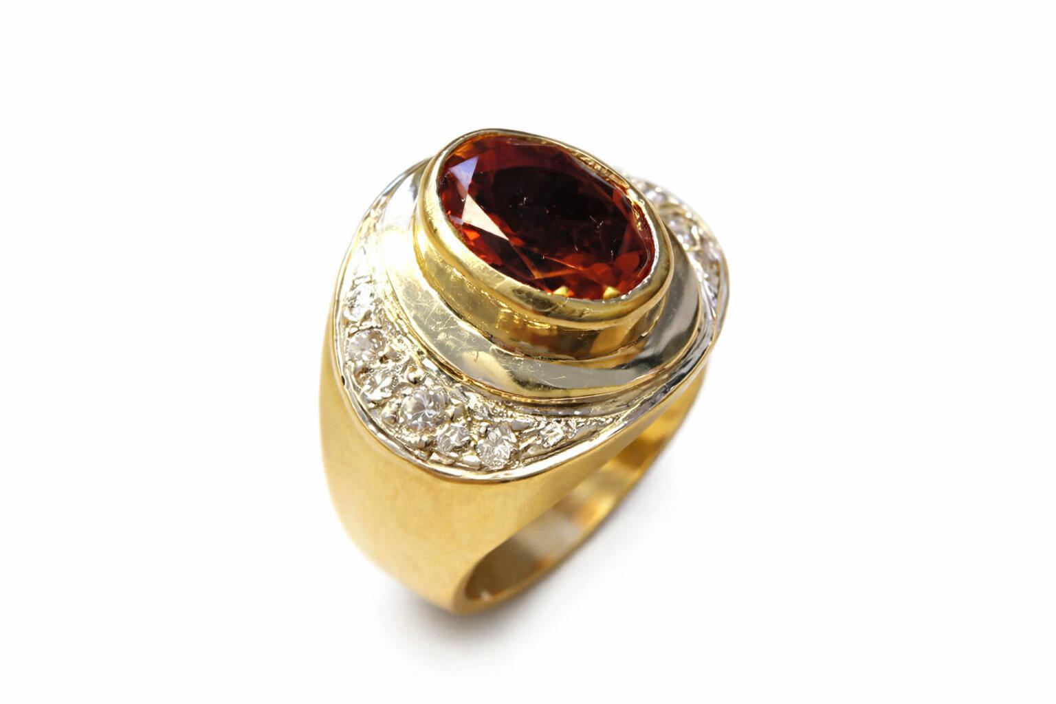 18ct yellow gold ring with 18ct white gold inlay set with an oval citrine and diamonds. 18ct yellow gold ring with 18ct white gold inlay set with an oval citrine and diamonds.